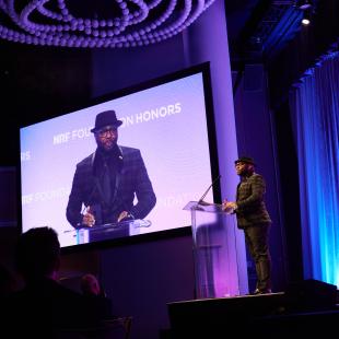 Robert Davison Long onstage at podium